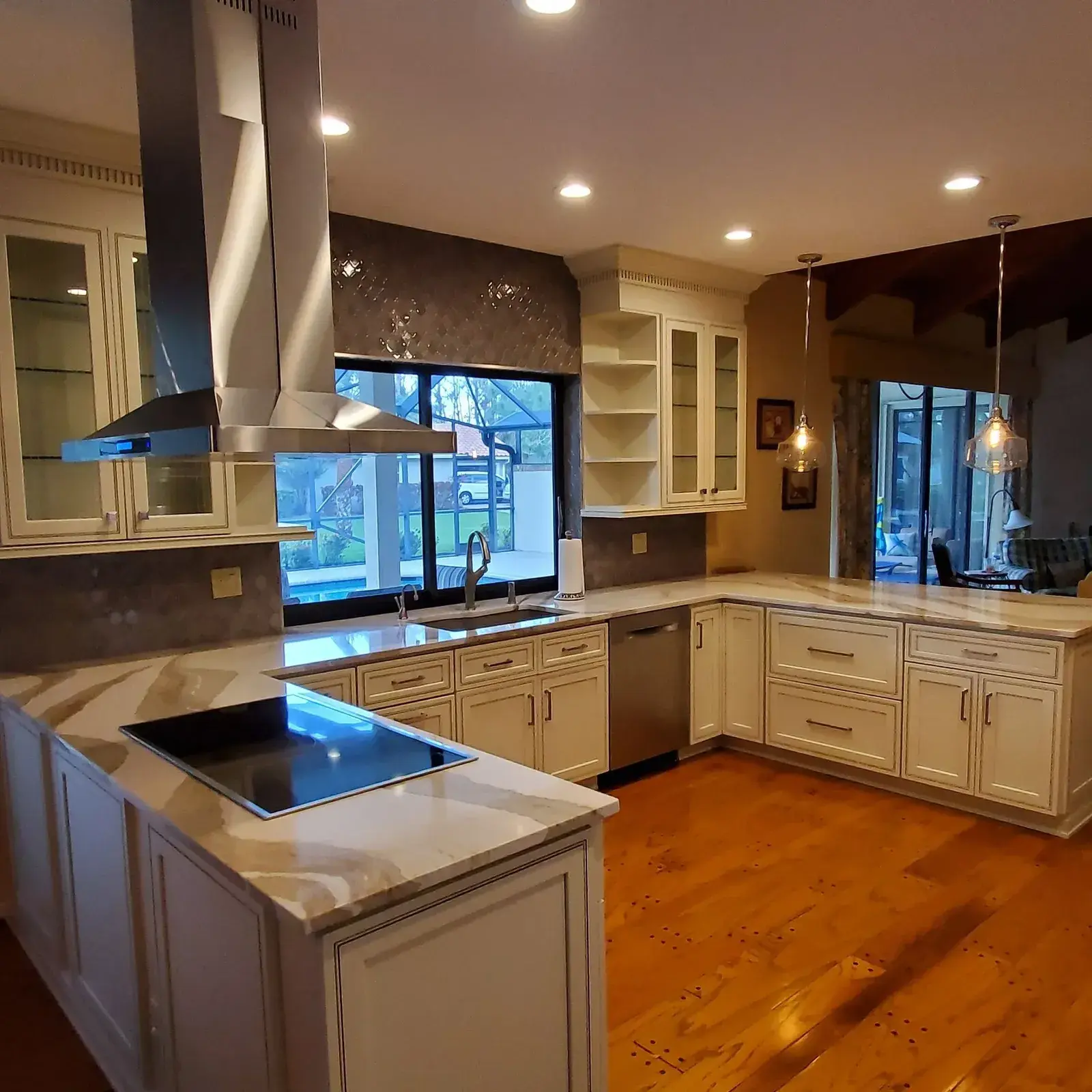 Wood cabinet kitchen with large stone island