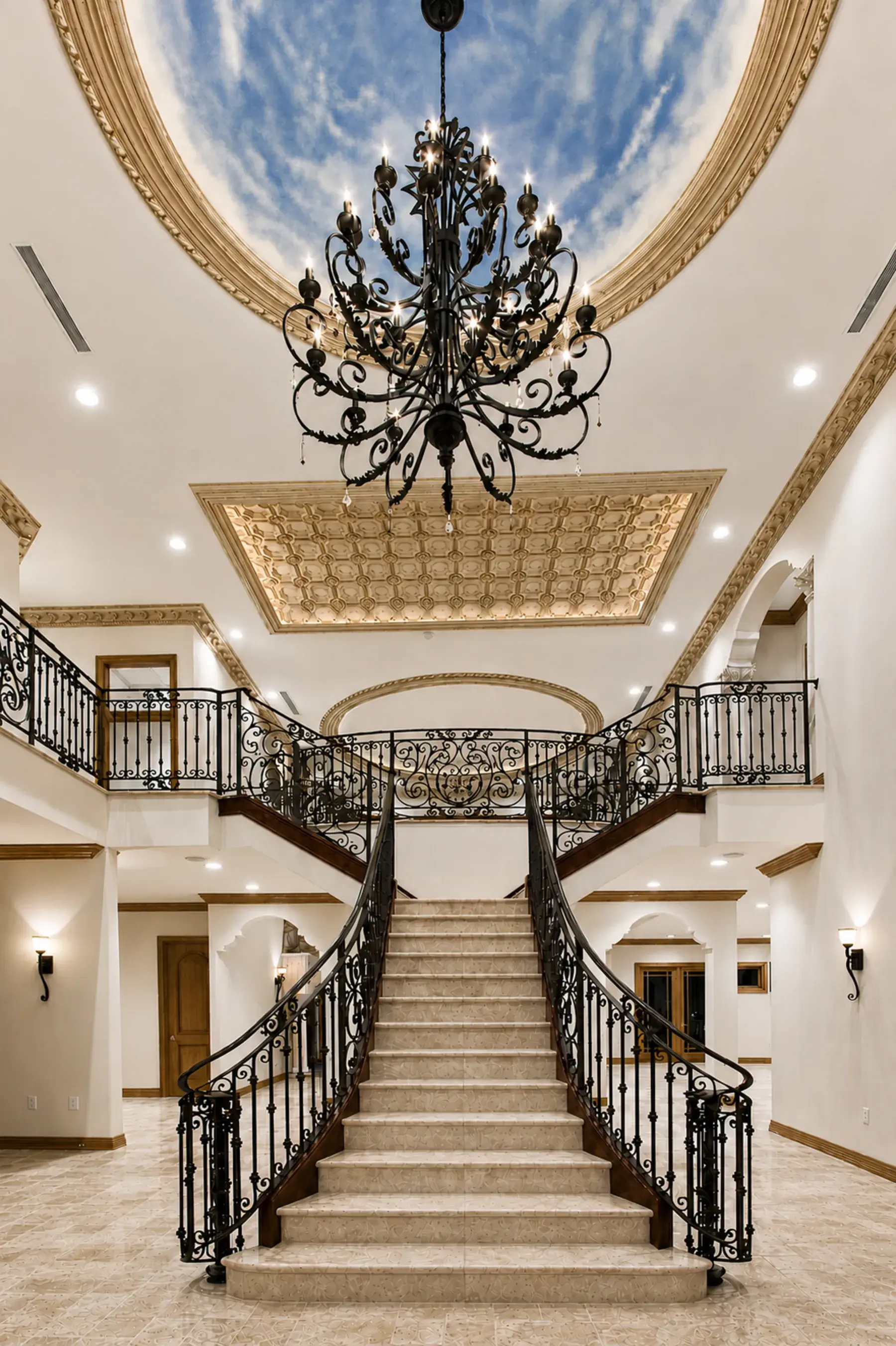 Renovated rotunda staircase beneath a domed ceiling